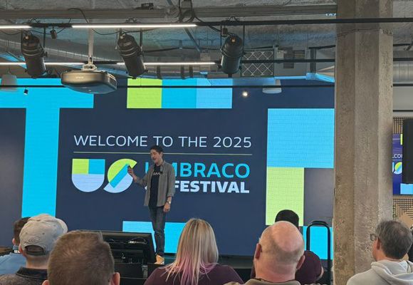 A speaker on the stage at the Umbraco festival held in Chicago. 
