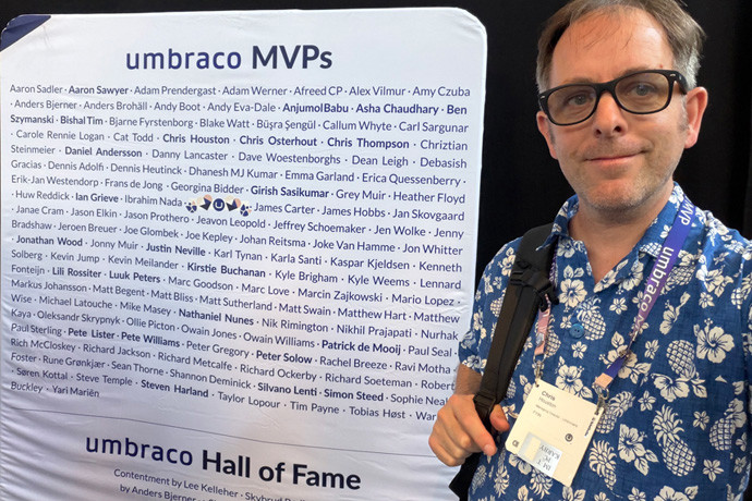 MVP Chris Houston Managing Director of Umbricians standing in front of list of Umbraco MVPs.